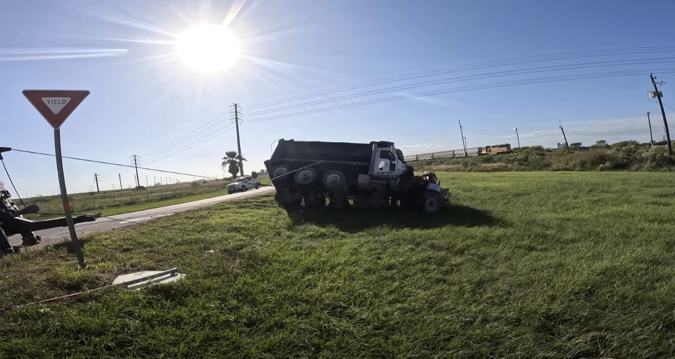 Heavy duty dump truck stuck in a field requiring heavy duty towing service in Cardiff, CA